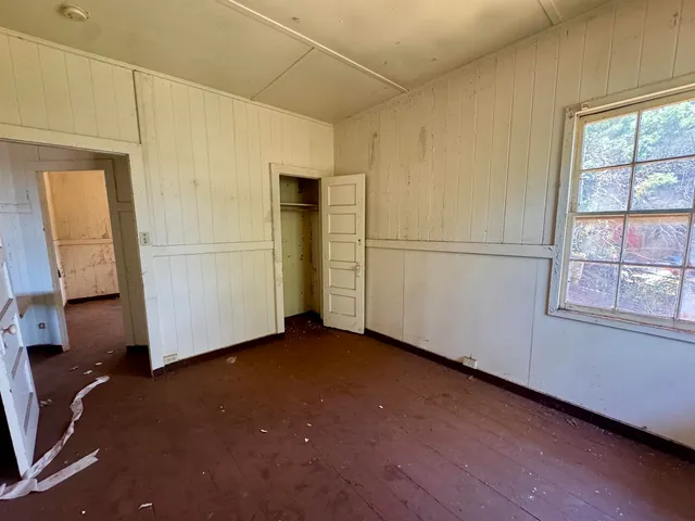 a view of a storage & utility room with closet