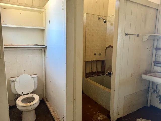 a view of a yard with snow on the road