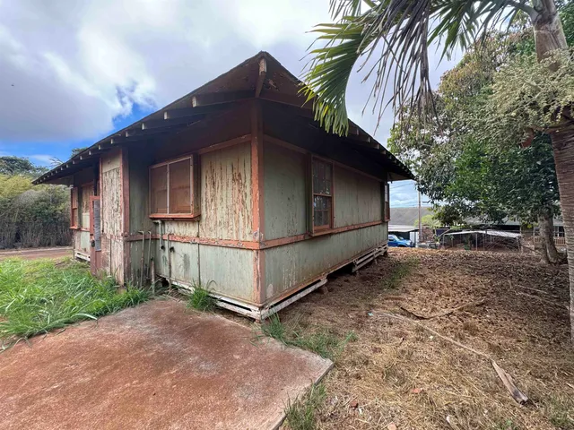 a house view with a backyard space