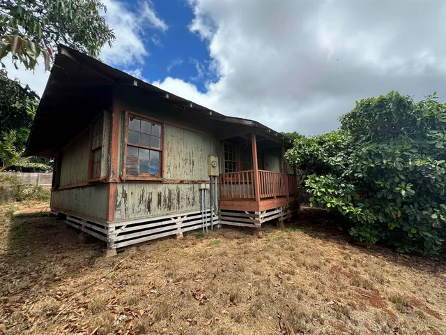 a house with trees in front of it