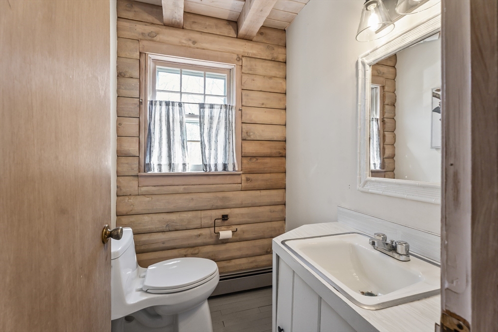 7 Pip'n Road Edgartown, MA 02539 - Photo 8 of 41 a bathroom with a sink a toilet and a mirror