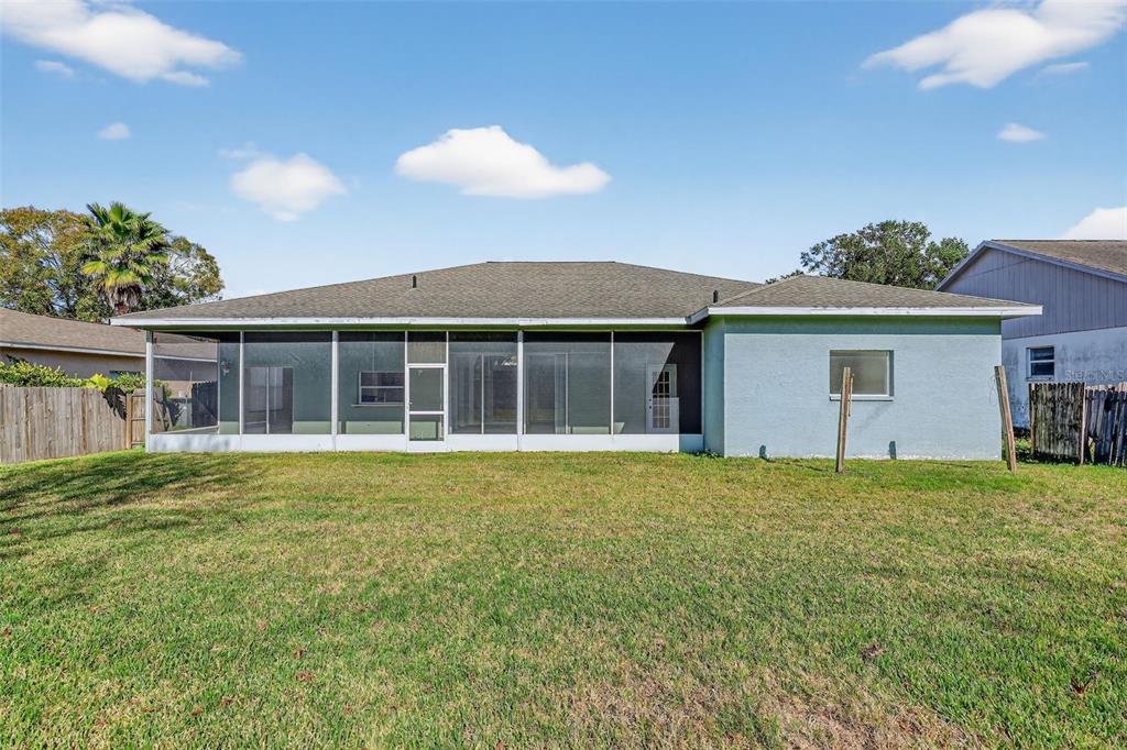 28244 Brokenmead Path Wesley Chapel, FL 33543 - Photo 33 of 37 a front view of a house with a garden