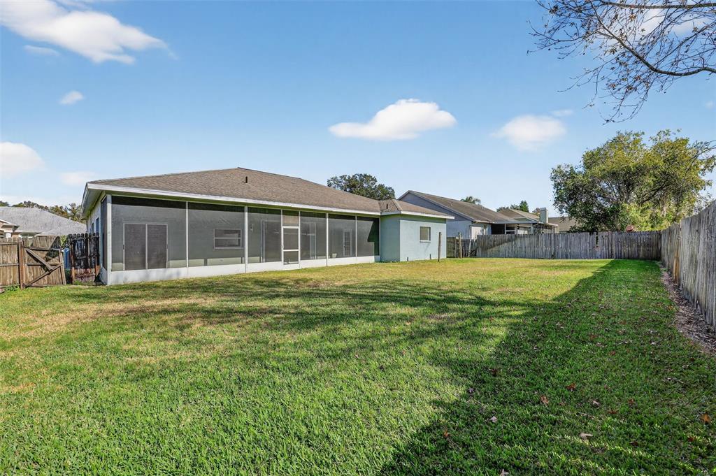 28244 Brokenmead Path Wesley Chapel, FL 33543 - Photo 34 of 37 a front view of a house with a garden