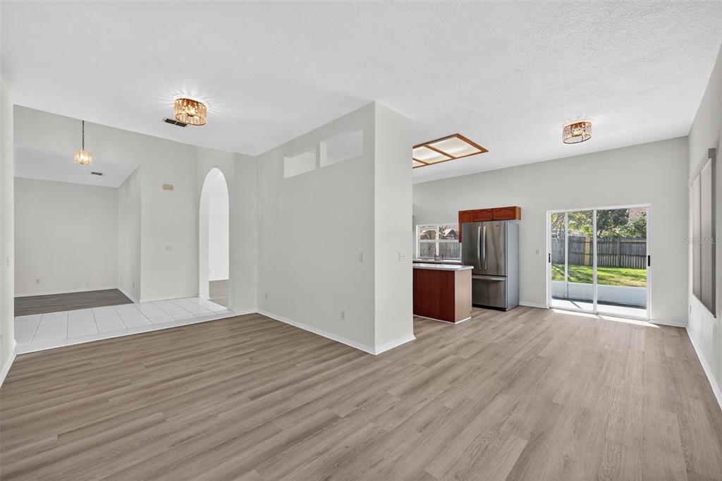 28244 Brokenmead Path Wesley Chapel, FL 33543 - Photo 9 of 37 a view of a room with wooden floor and window