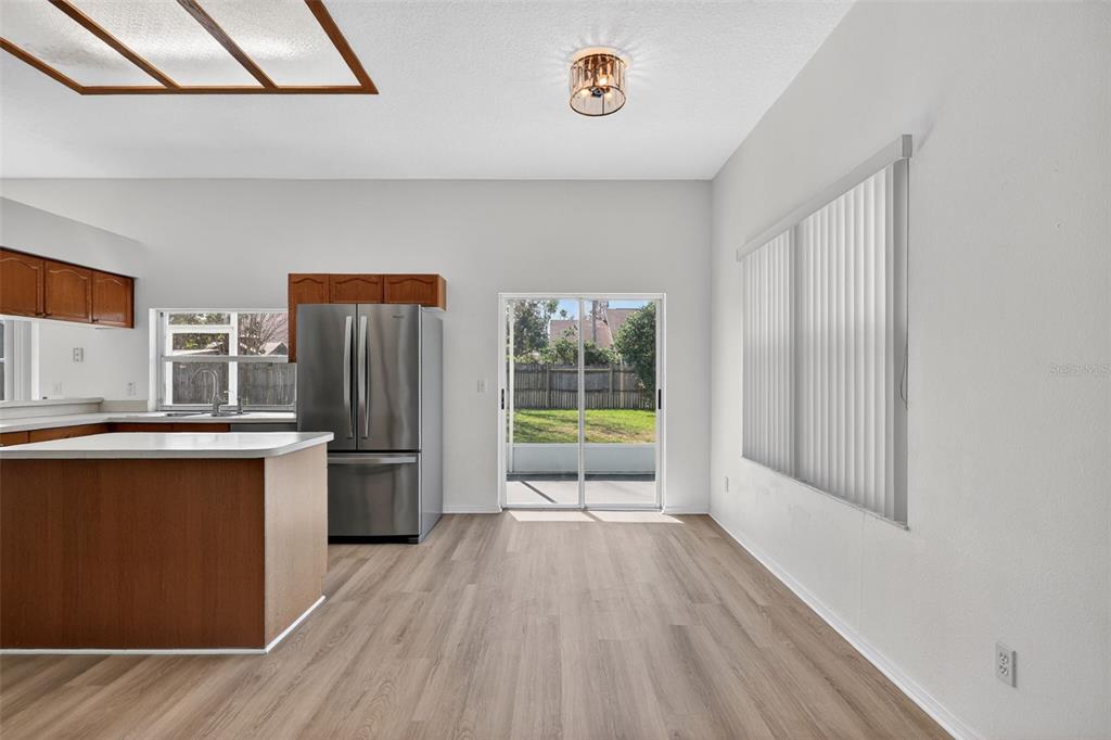 28244 Brokenmead Path Wesley Chapel, FL 33543 - Photo 10 of 37 a kitchen with stainless steel appliances granite countertop a refrigerator a sink and a stove