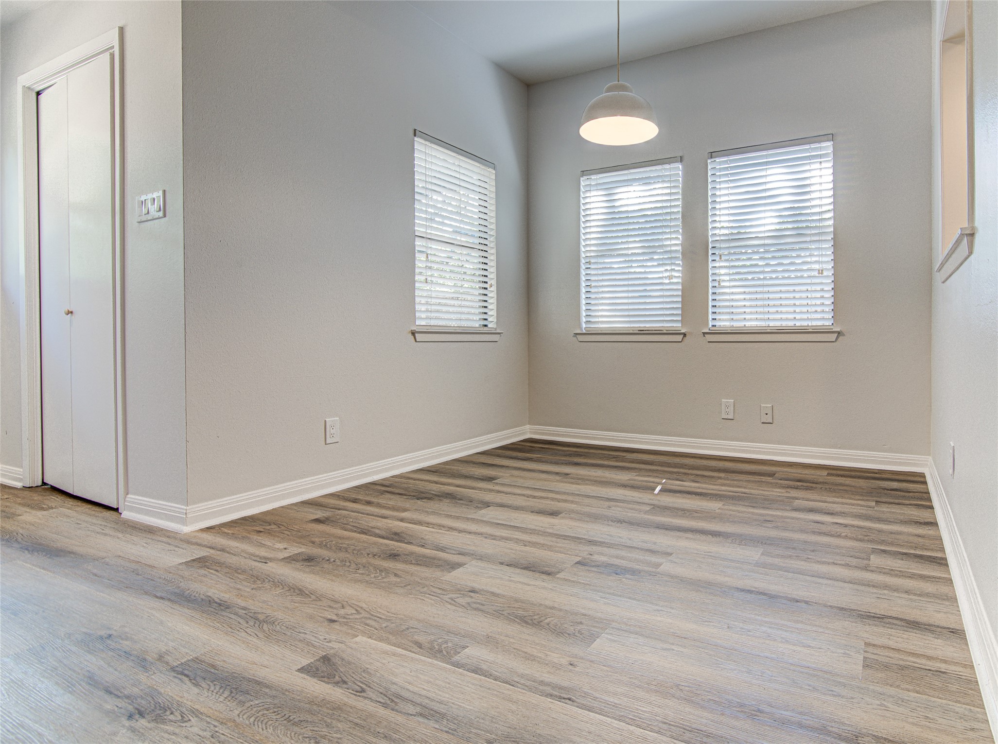 311 West Mary Street Austin, TX 78704 - Photo 6 of 35 Sun-filled interior space with beautiful wood-like flooring and ample natural light.