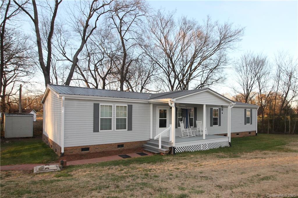 205 Sikes Mill Road Monroe, NC 28110 - Photo 3 of 37 a front view of a house with a yard