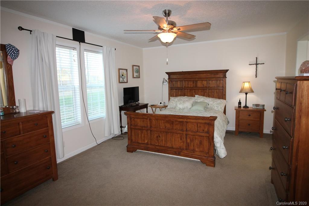 205 Sikes Mill Road Monroe, NC 28110 - Photo 22 of 37 a bed room with a bed furniture and a window