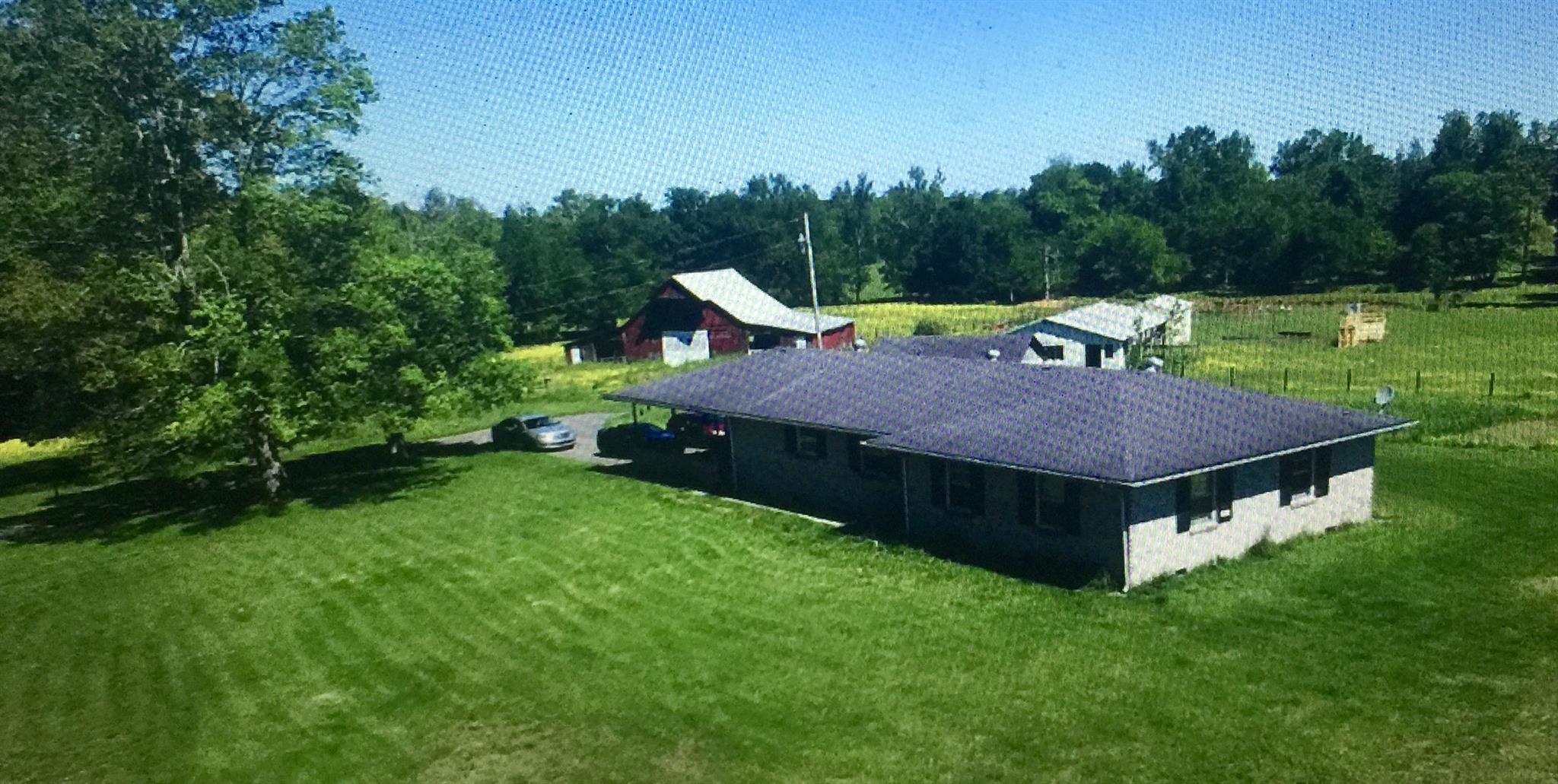 5582 Shady Grove Road Morrison, TN 37357 - Photo 1 of 11 a aerial view of a house with a yard patio and green space