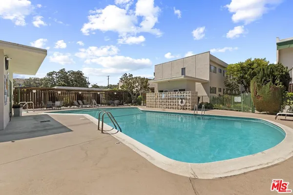 a view of a swimming pool with a in backyard