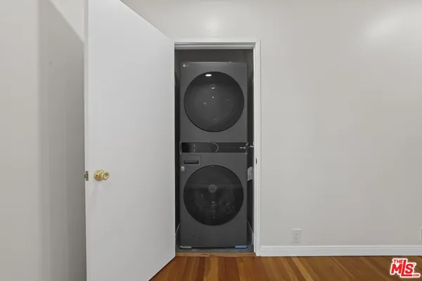a view of a hallway with washer and dryer