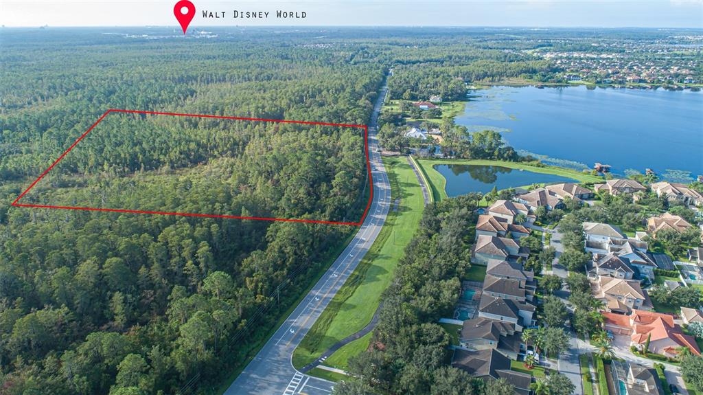 7545 Ficquette Road Windermere, FL 34786 - Photo 2 of 23 an aerial view of green landscape with outdoor space