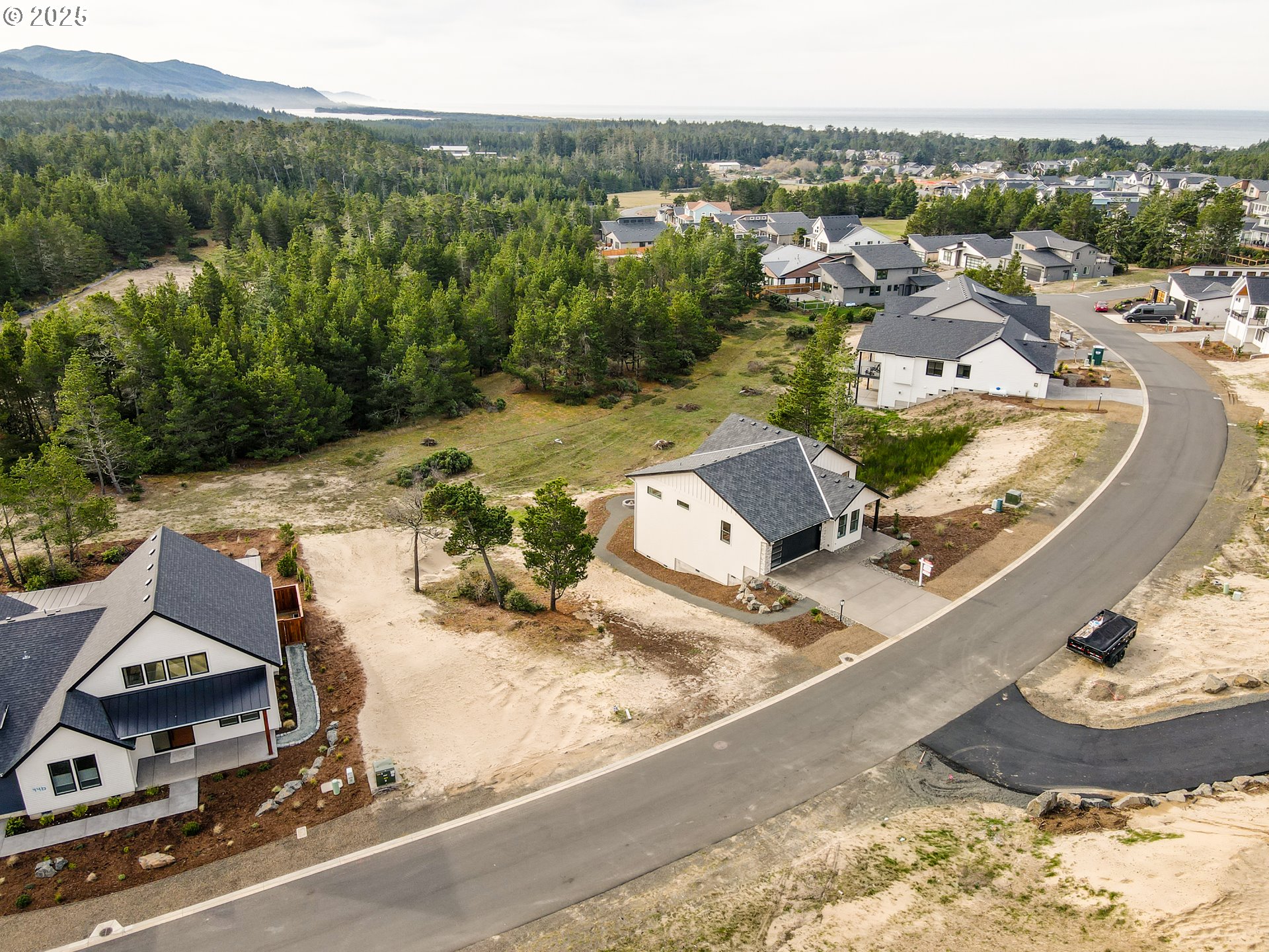an aerial view of residential houses with outdoor space