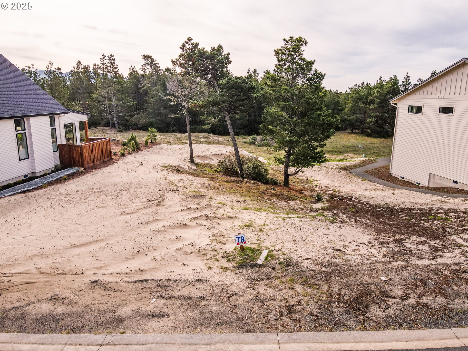 456 Meadows Drive, Unit 78 Nehalem, OR 97131 - Photo 3 of 21 a view of a backyard of the house