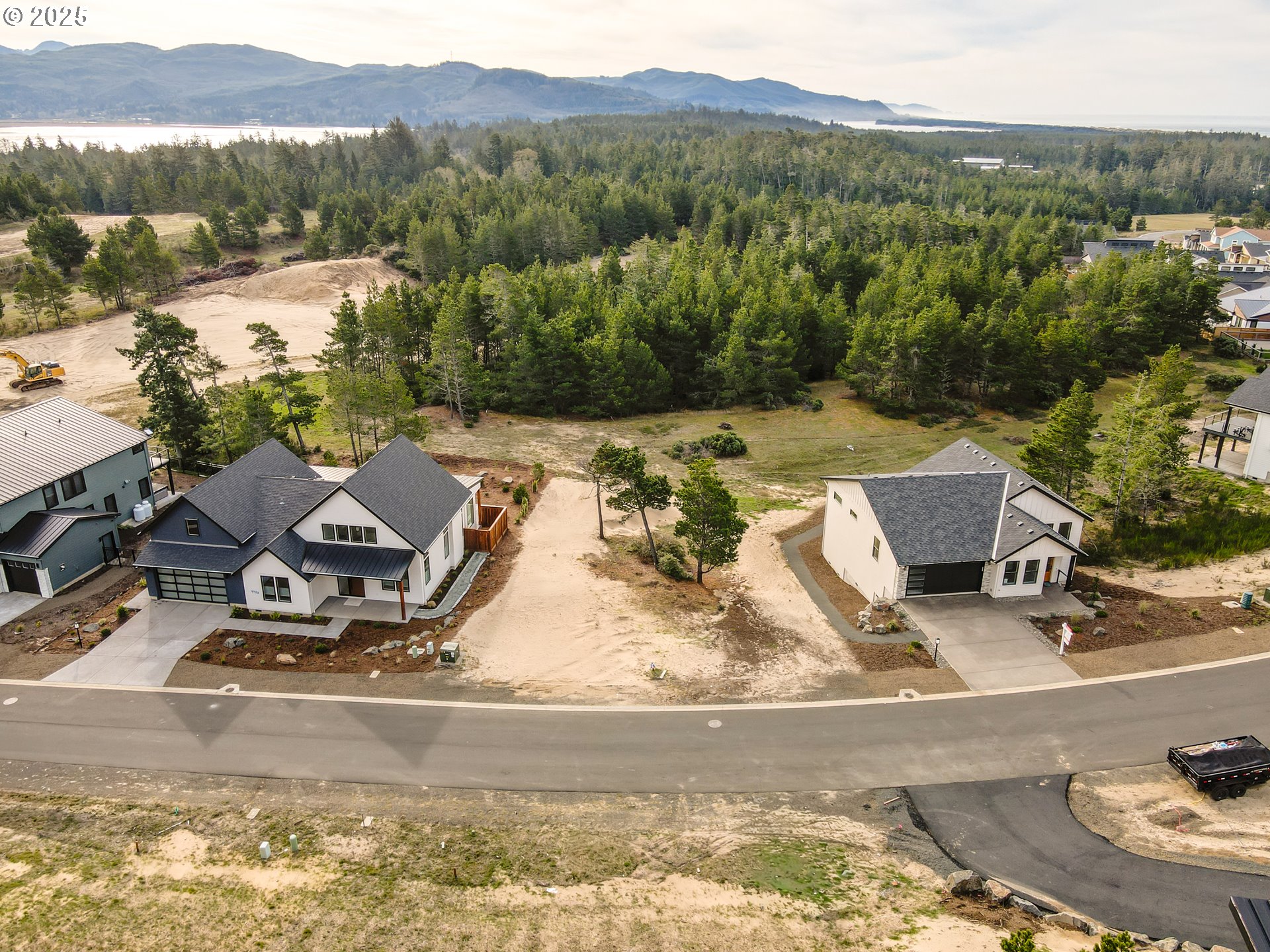 456 Meadows Drive, Unit 78 Nehalem, OR 97131 - Photo 6 of 21 a view of a lake with a mountain