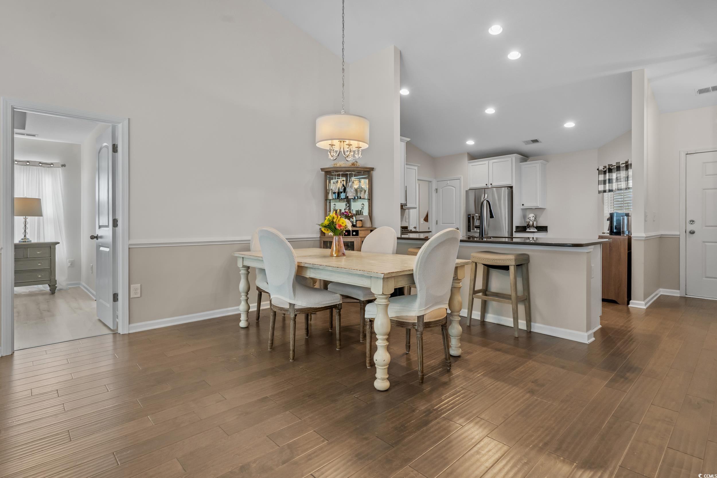 733 Old Castle Loop Myrtle Beach, SC 29579 - Photo 11 of 39 Dining space featuring dark wood-style floors, hig