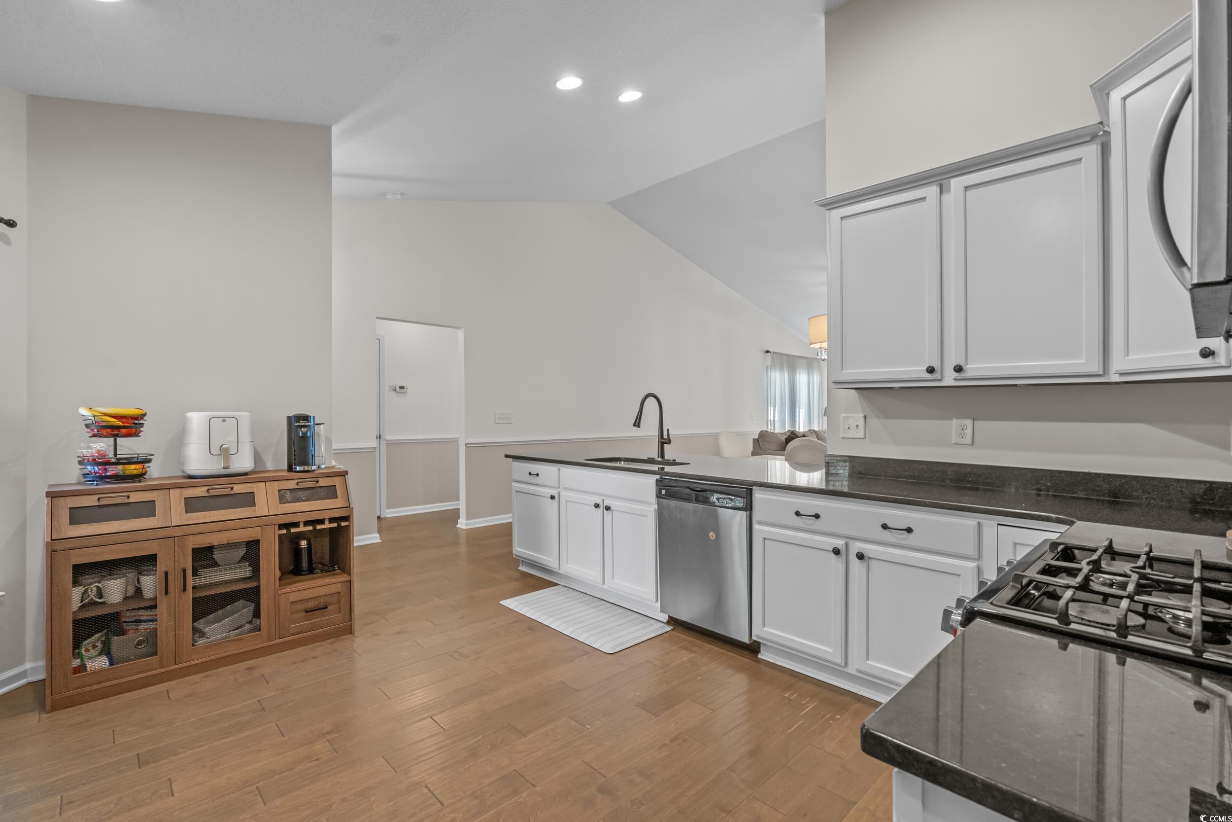 733 Old Castle Loop Myrtle Beach, SC 29579 - Photo 14 of 39 Kitchen with a peninsula, dishwasher, light wood f