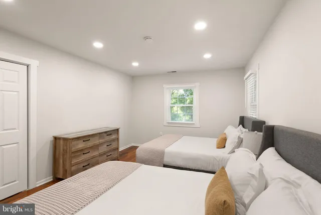 a bedroom with bed and window