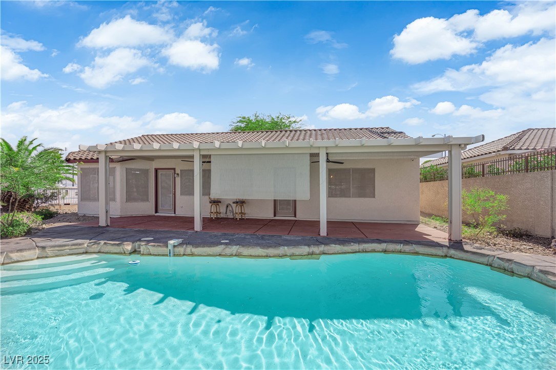 650 West Victory Road Henderson, NV 89015 - Photo 25 of 35 View of pool with a ceiling fan and a patio area