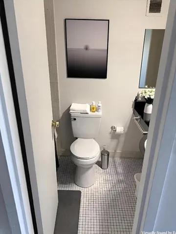 a bathroom with a toilet and a sink