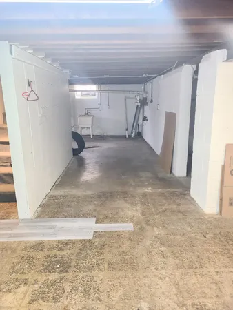 a view of a room with white walls