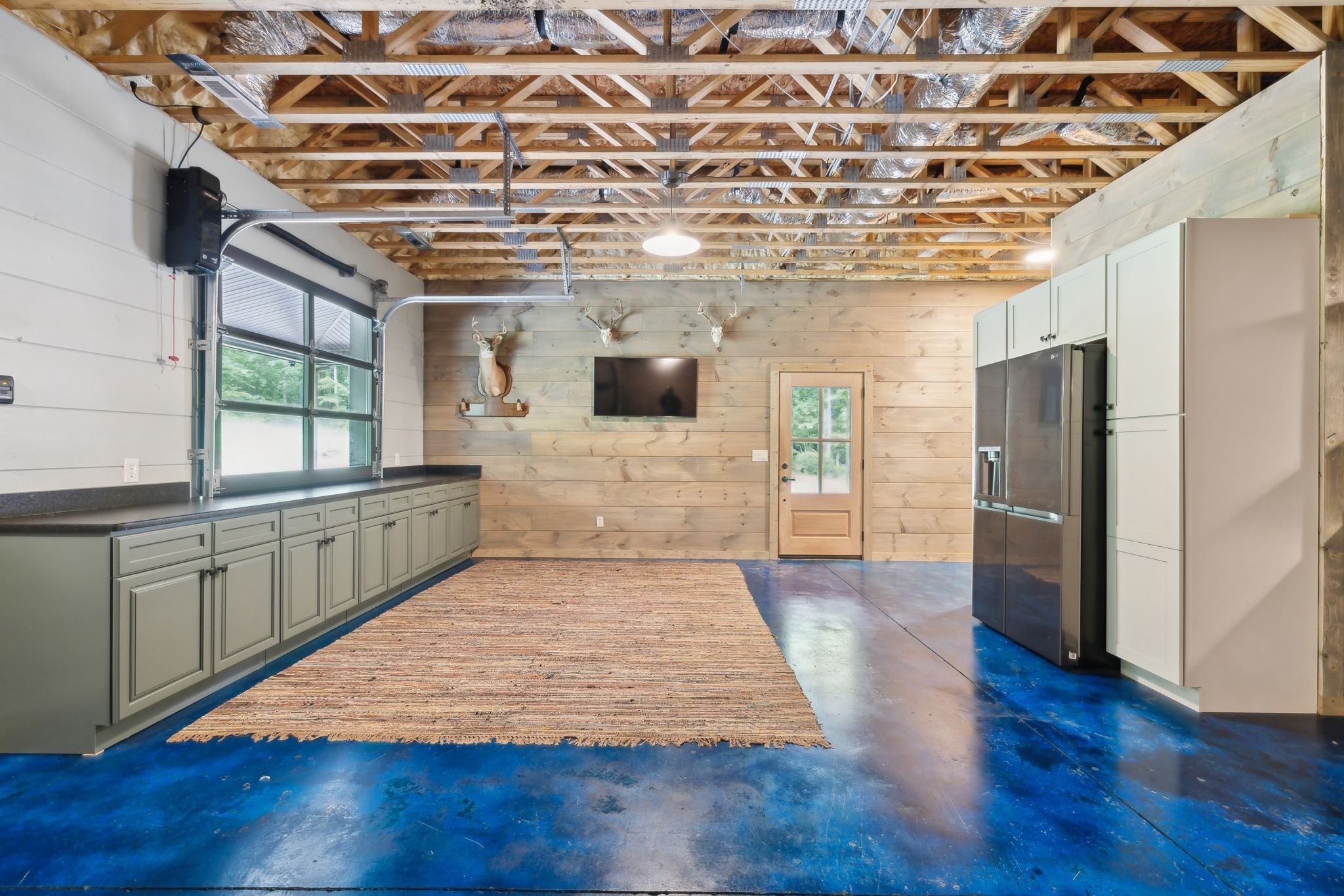 1785 St Johns Road Lascassas, TN 37085 - Photo 28 of 46 a large room with a large window wooden floor and stainless steel appliances