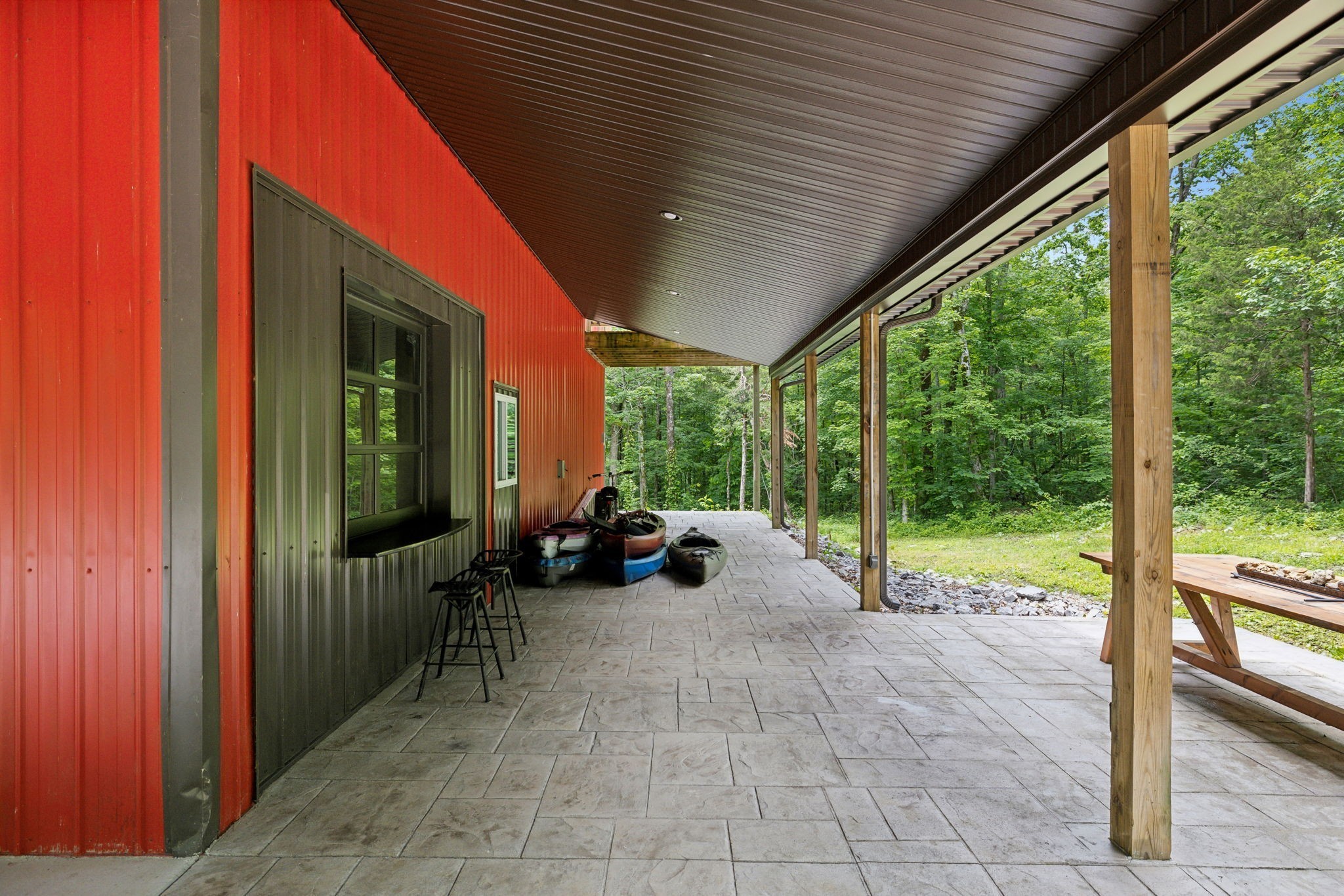 1785 St Johns Road Lascassas, TN 37085 - Photo 32 of 46 a view of a porch with chairs and floor to ceiling window
