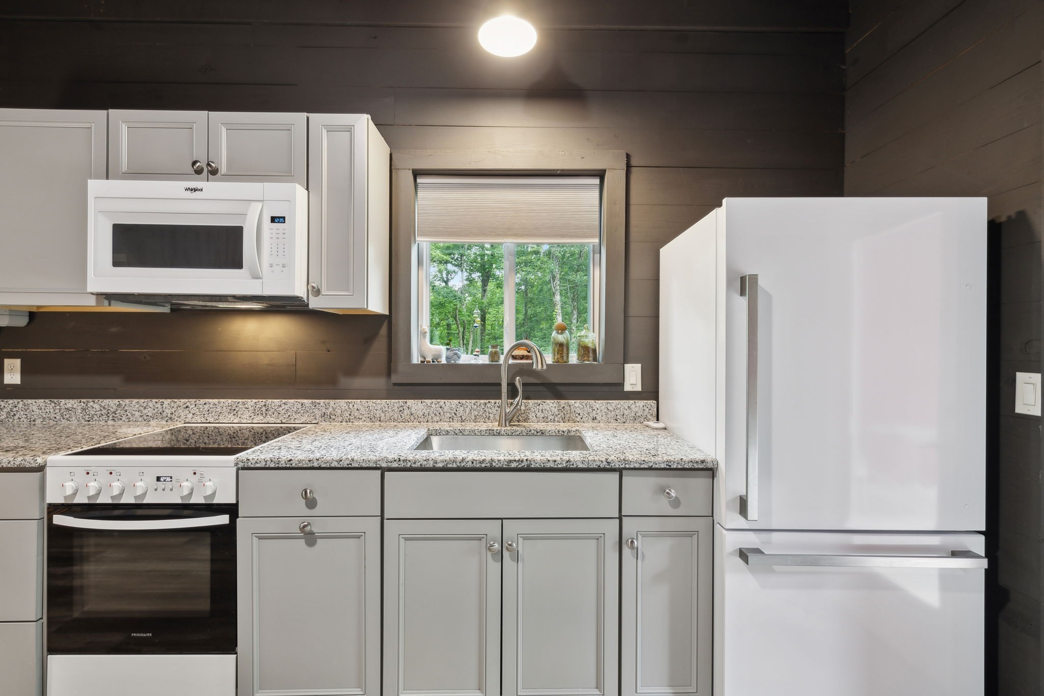 1785 St Johns Road Lascassas, TN 37085 - Photo 39 of 46 a kitchen with granite countertop white cabinets white stainless steel appliances and a refrigerator