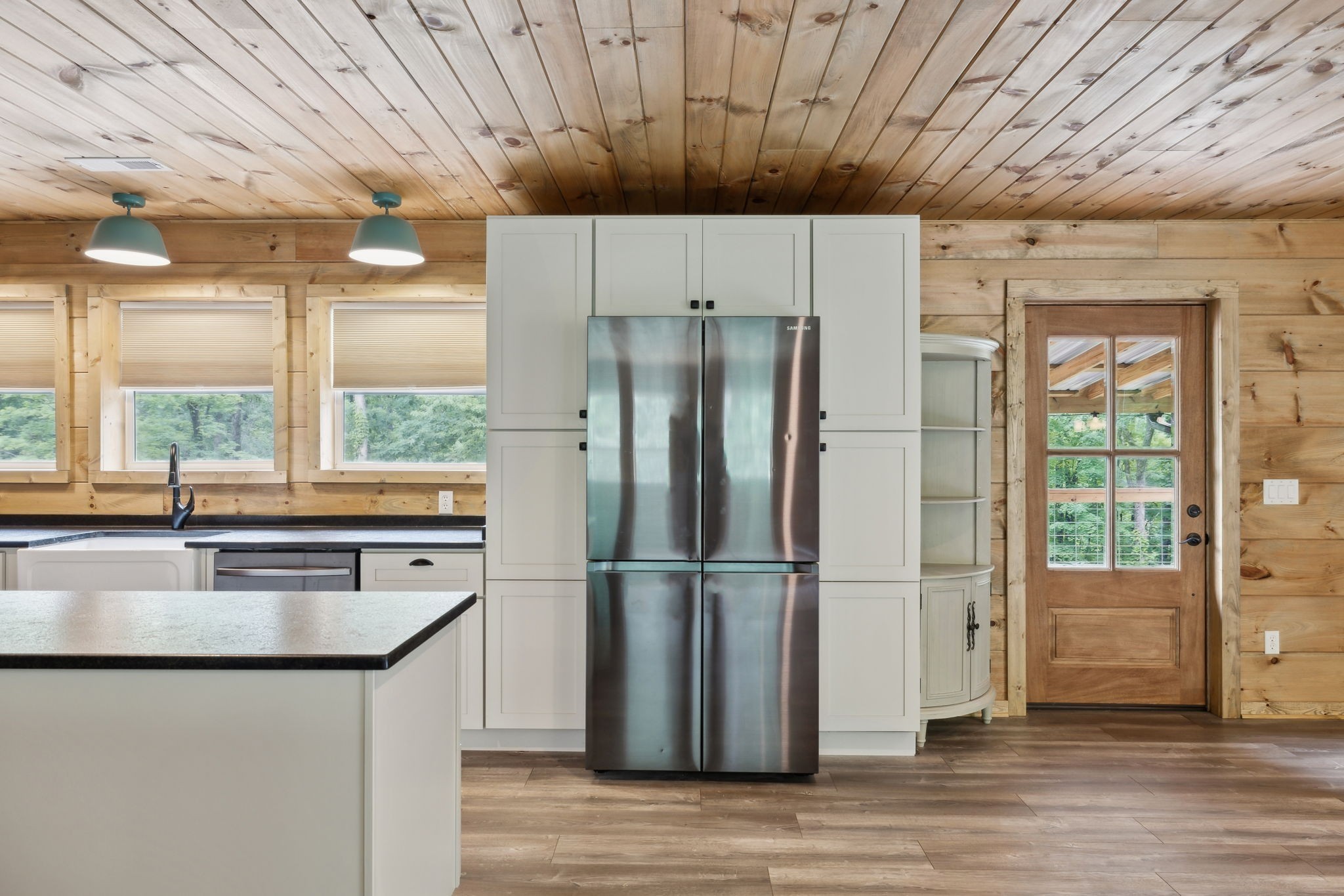 1785 St Johns Road Lascassas, TN 37085 - Photo 6 of 46 a kitchen with stainless steel appliances granite countertop a refrigerator a sink and a dishwasher with wooden floor