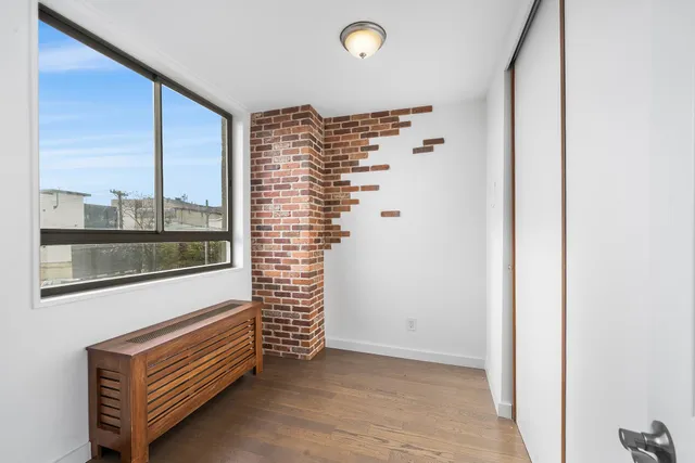 a view of a room with a large window