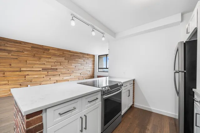 a kitchen that has a sink and a stove