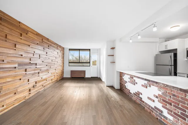 a view of front door with wooden floor