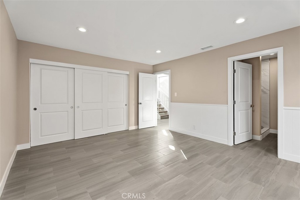 54 Oak Tree Lane Irvine, CA 92612 - Photo 18 of 40 a view of an empty room with wooden floor