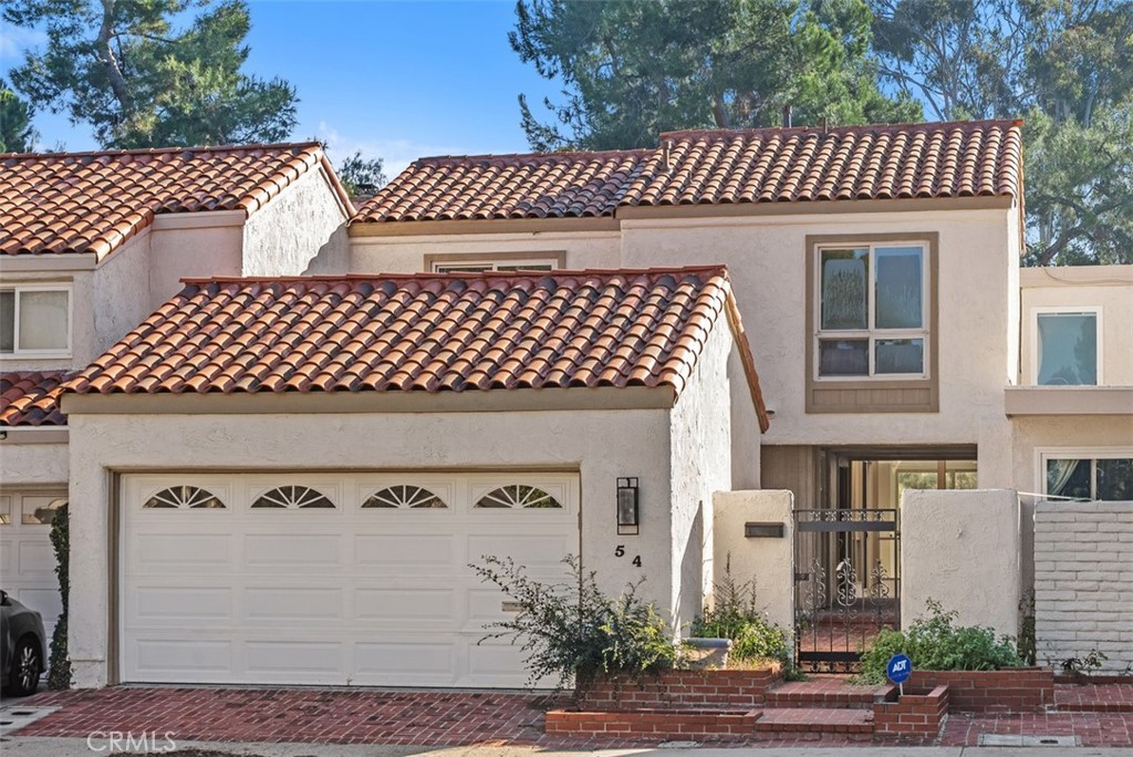 54 Oak Tree Lane Irvine, CA 92612 - Photo 2 of 40 a front view of a house