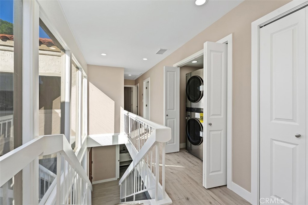54 Oak Tree Lane Irvine, CA 92612 - Photo 22 of 40 a view of entryway and hall with wooden floor