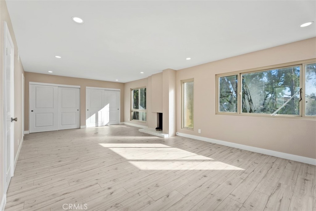 54 Oak Tree Lane Irvine, CA 92612 - Photo 30 of 40 a view of an empty room with wooden floor and a window