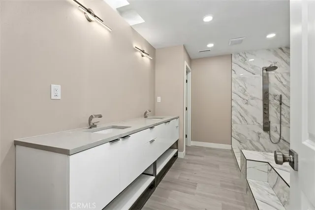 a bathroom with a bathtub and a sink