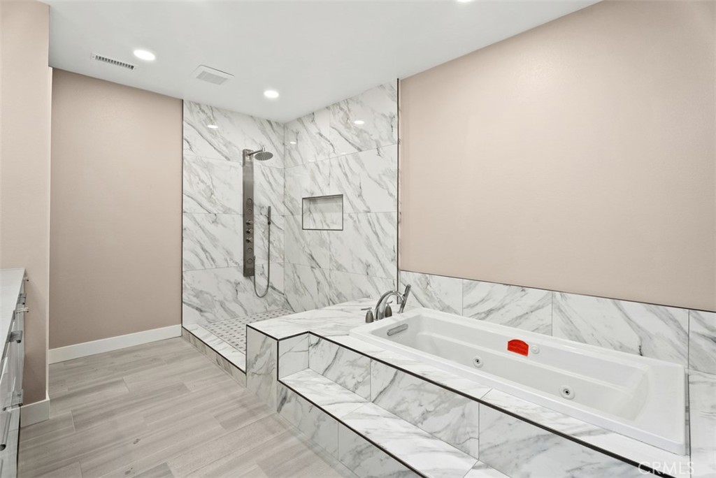 54 Oak Tree Lane Irvine, CA 92612 - Photo 34 of 40 a bathroom with a bathtub and a sink