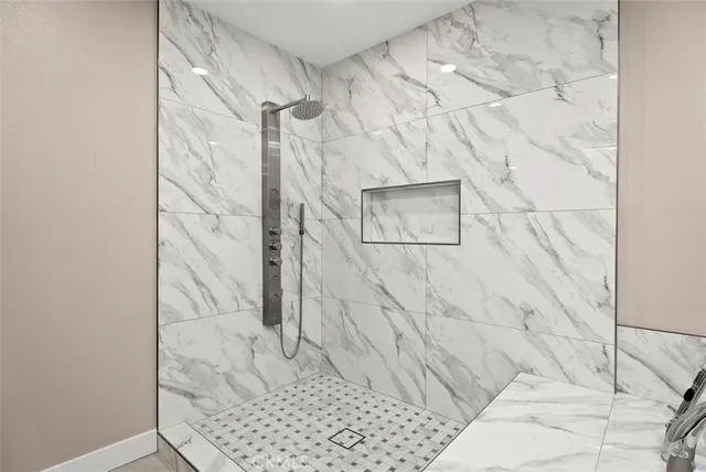 a view of a patio with chairs and a fire pit