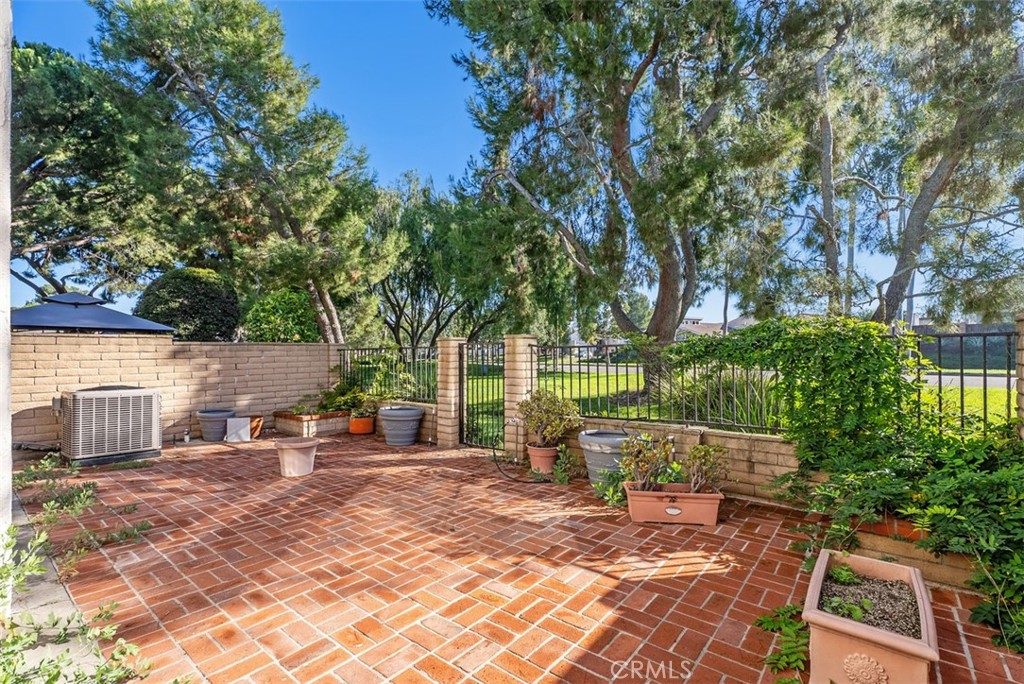 54 Oak Tree Lane Irvine, CA 92612 - Photo 36 of 40 a view of a patio with chairs and a fire pit