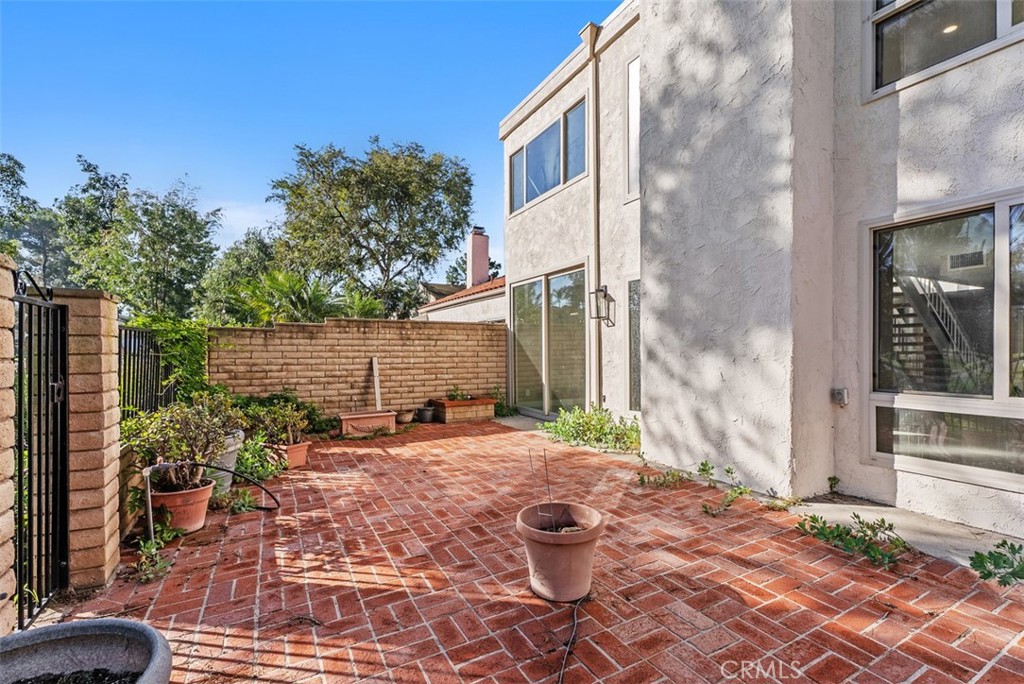 54 Oak Tree Lane Irvine, CA 92612 - Photo 39 of 40 a backyard of a house with outdoor seating