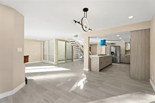 a view of a kitchen with a sink and cabinets
