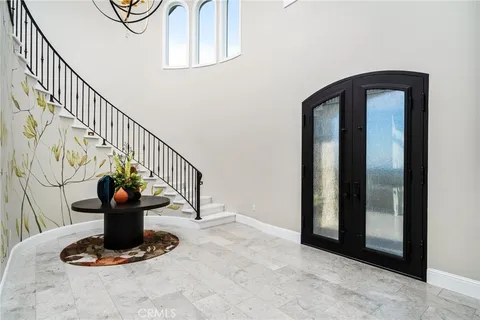 a kitchen with stainless steel appliances kitchen island granite countertop a refrigerator stove and sink