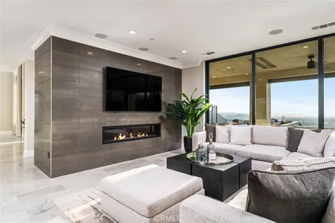 a bedroom with a large bed and a large window