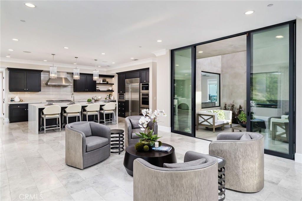 4485 Broken Spur Road La Verne, CA 91750 - Photo 18 of 75 a living room with furniture a fireplace and a flat screen tv