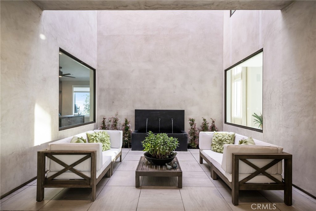 4485 Broken Spur Road La Verne, CA 91750 - Photo 19 of 75 a living room with furniture and a potted plant