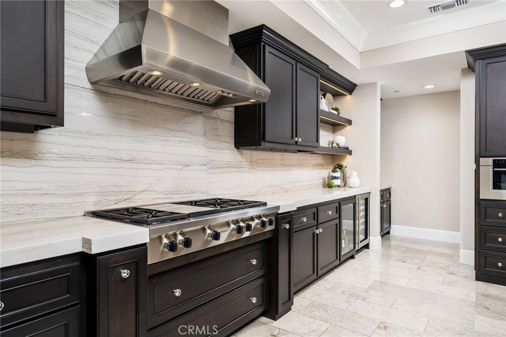 4485 Broken Spur Road La Verne, CA 91750 - Photo 22 of 75 a kitchen with stainless steel appliances granite countertop a stove and a refrigerator