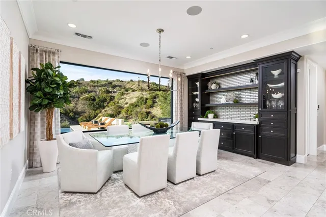 a spacious bathroom with a double vanity sink a large mirror and a bathtub