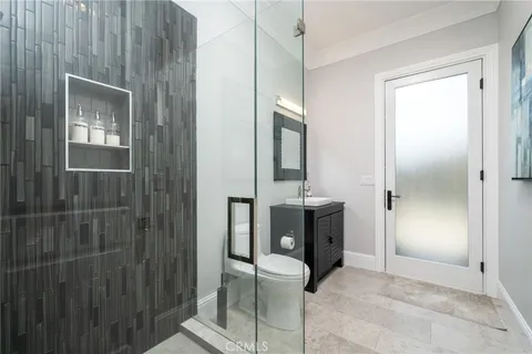 a bathroom with a sink a large mirror and a bathtub