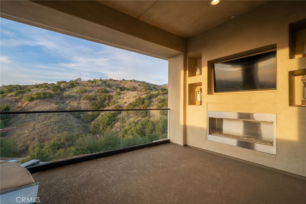 4485 Broken Spur Road La Verne, CA 91750 - Photo 34 of 75 a view of a balcony with a floor to ceiling window and stairs